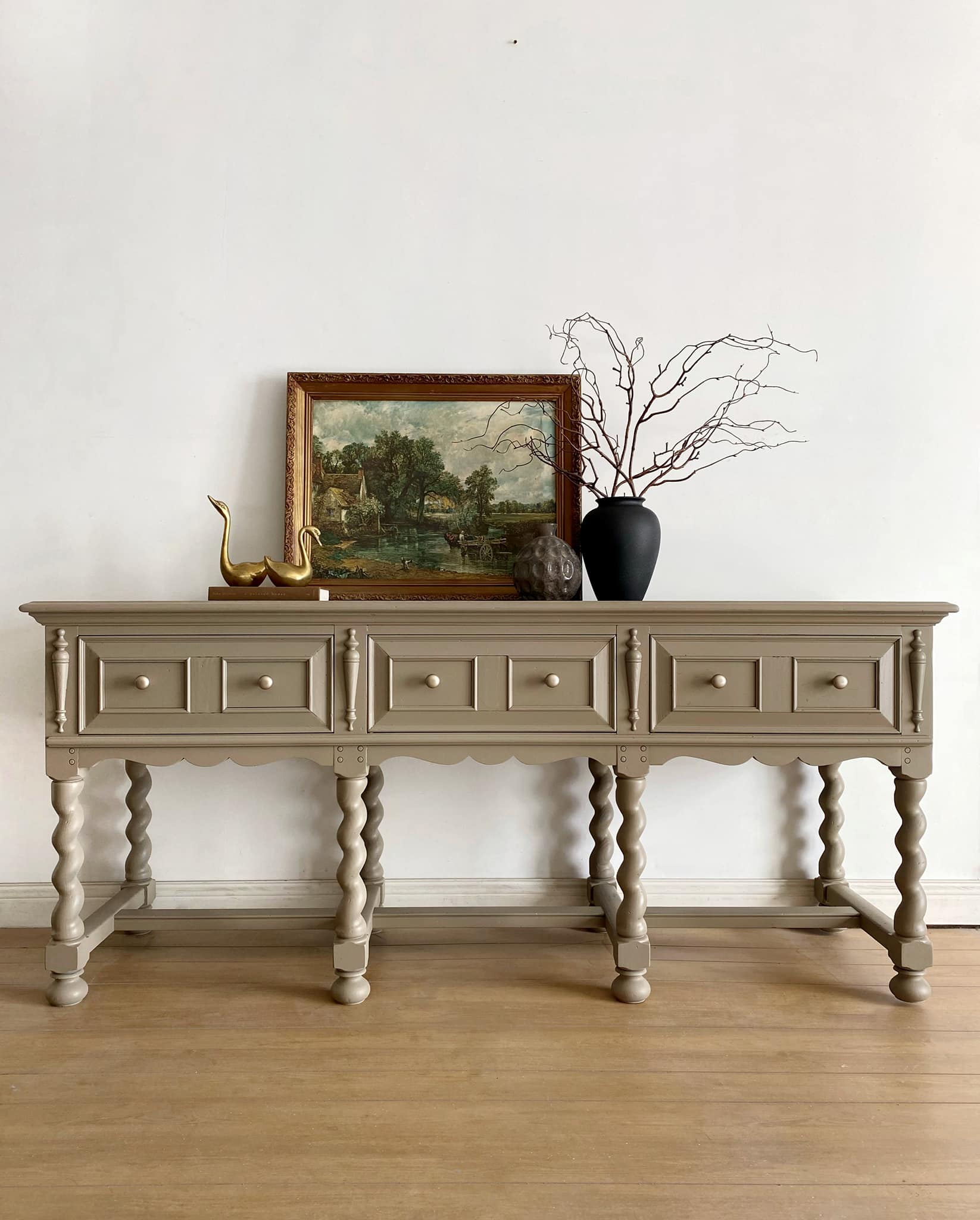 Brown painted ornate console table with spiral spindle legs