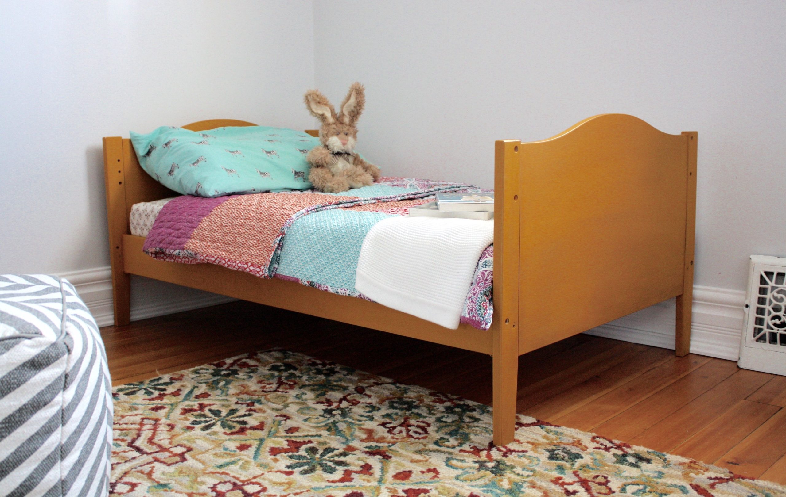 Mustard yellow painted girl's bed frame