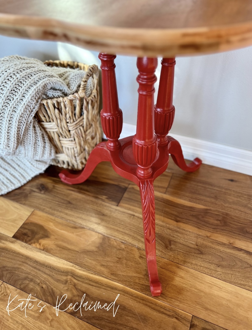 Ornate side table legs painted red