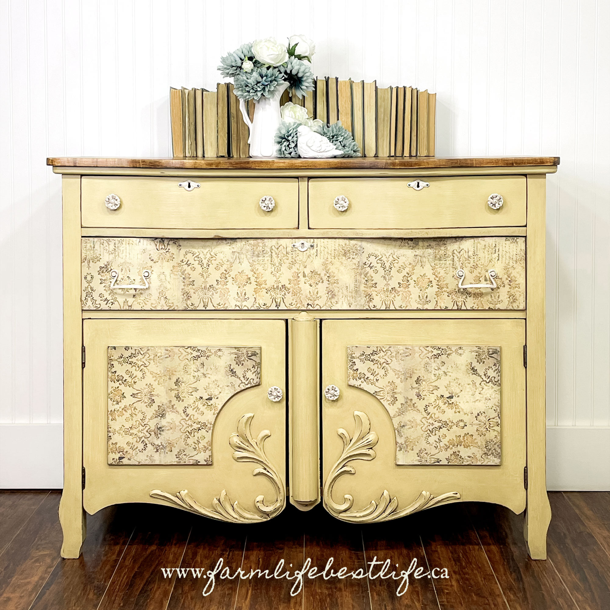 pale yellow dresser/cabinet with natural wood top and rice paper drawer fronts