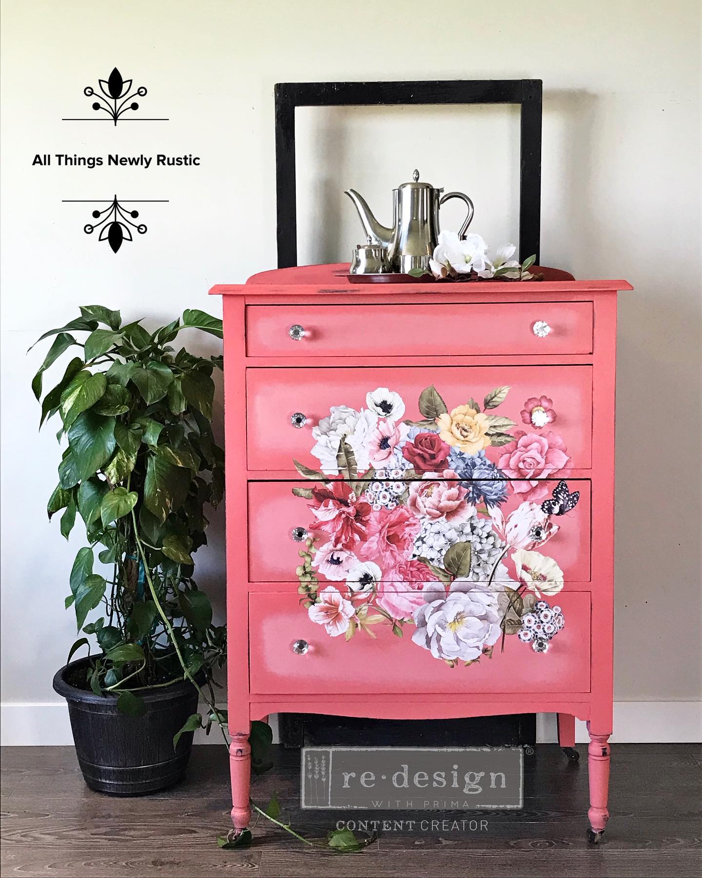 tall dresser in bright coral with floral transfer potted plant